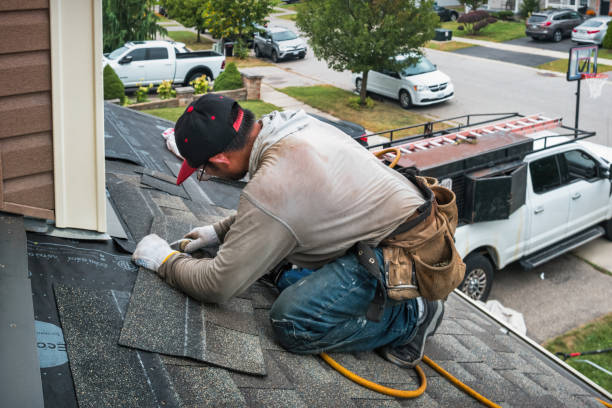 Professional Roofing technician working in North Sutton, NH